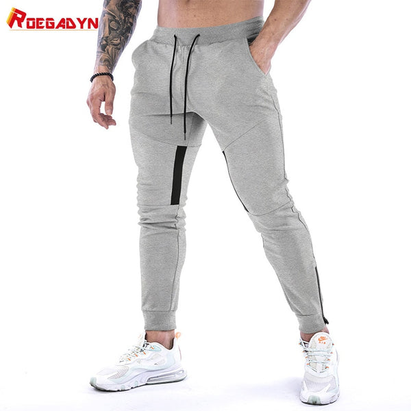 Fitness Joggers & Tracksuit Jogging bottoms for Men with Foot Mouth ZiSPECIFICATIONS
Full length slim fit, soft cotton joggers tight at the ankles with a stylish and practical foot mouth zipper. Other features include side pockets and 0formyworkout.com